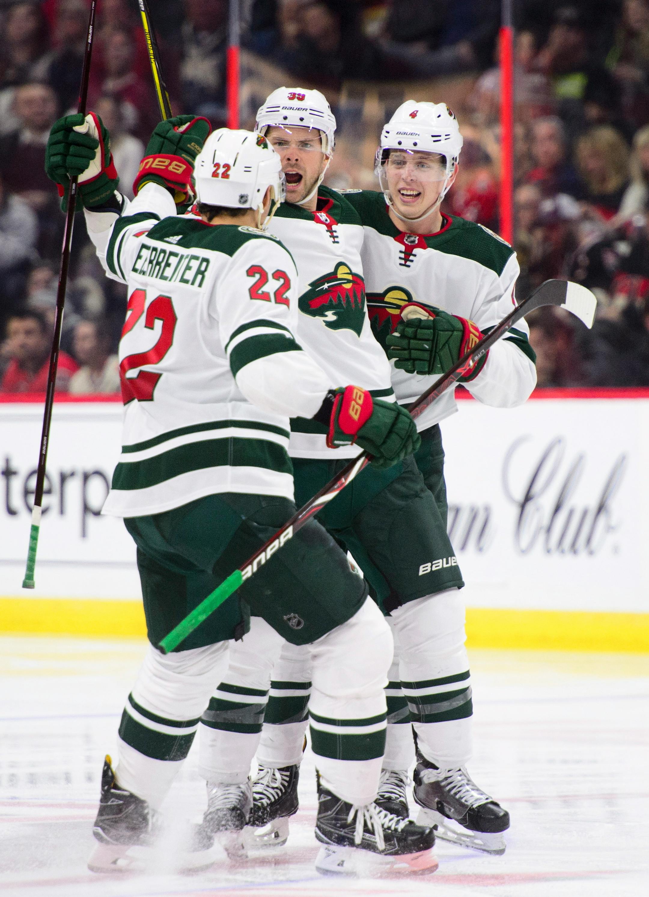 Minnesota Wild's Nino Niederreiter, left to right, Nate Prosser and Mike Reilly celebrate a goal against the Ottawa Senators during third period NHL hockey action in Ottawa on Tuesday, Dec. 19, 2017. (Sean Kilpatrick/The Canadian Press via AP)