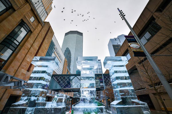 An LII ice sculpture greets people at 6th Street and Nicollet Mall. (GLEN STUBBE/Star Tribune)