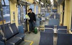 Peter Phillip rides an an almost empty Light Rail during the p.m. rush hour after collecting groceries in Minneapolis, Monday, April 13, 2020, during 