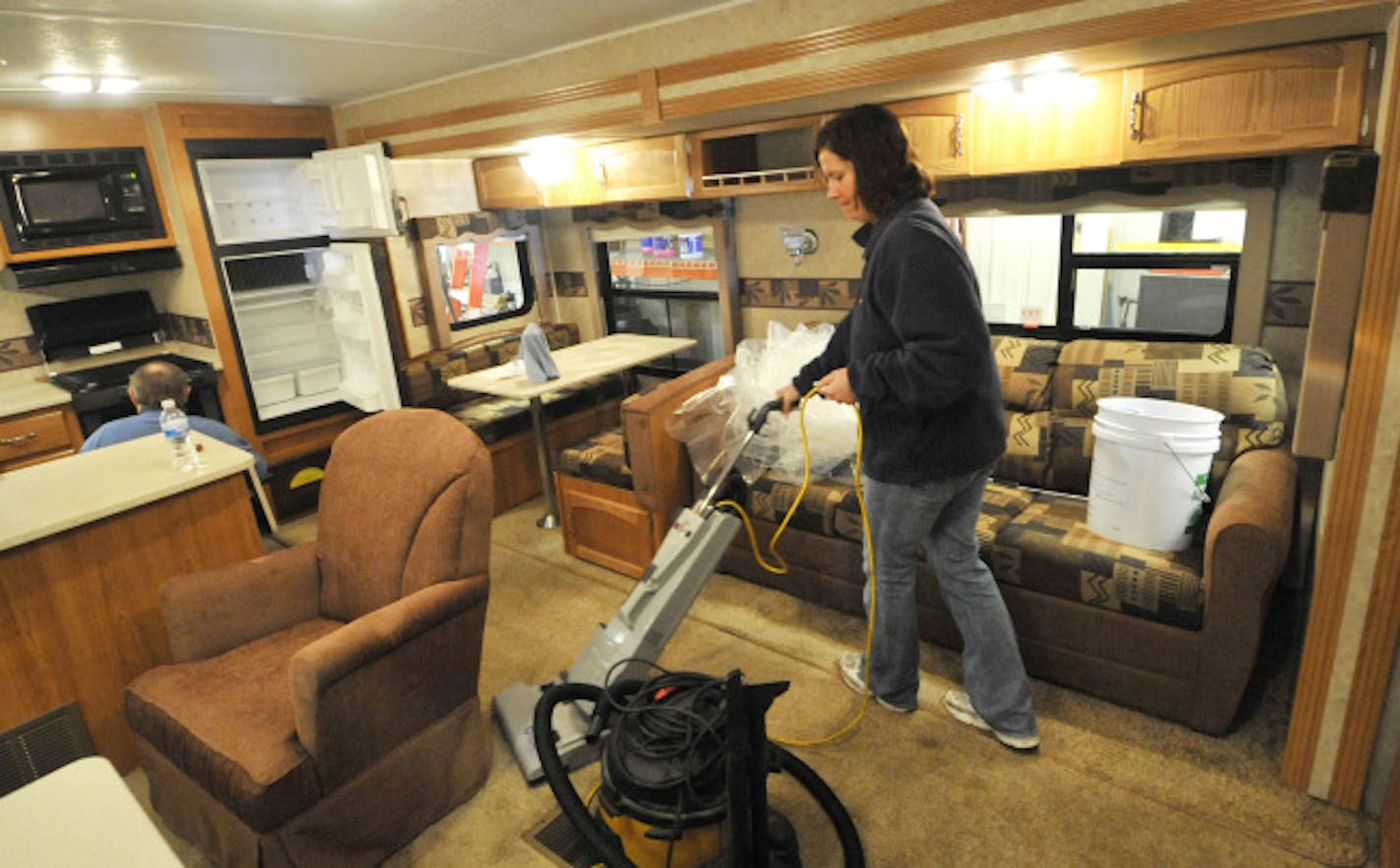 Sheri Schrot prepared a 29-foot Puma travel trailer for Noble's anniversary sale, at which manufacturer's representatives will be available to answer consumers' questions. Noble RV's proximity to a Cabela's store is advantageous, because both businesses attract many of the same kinds of people.