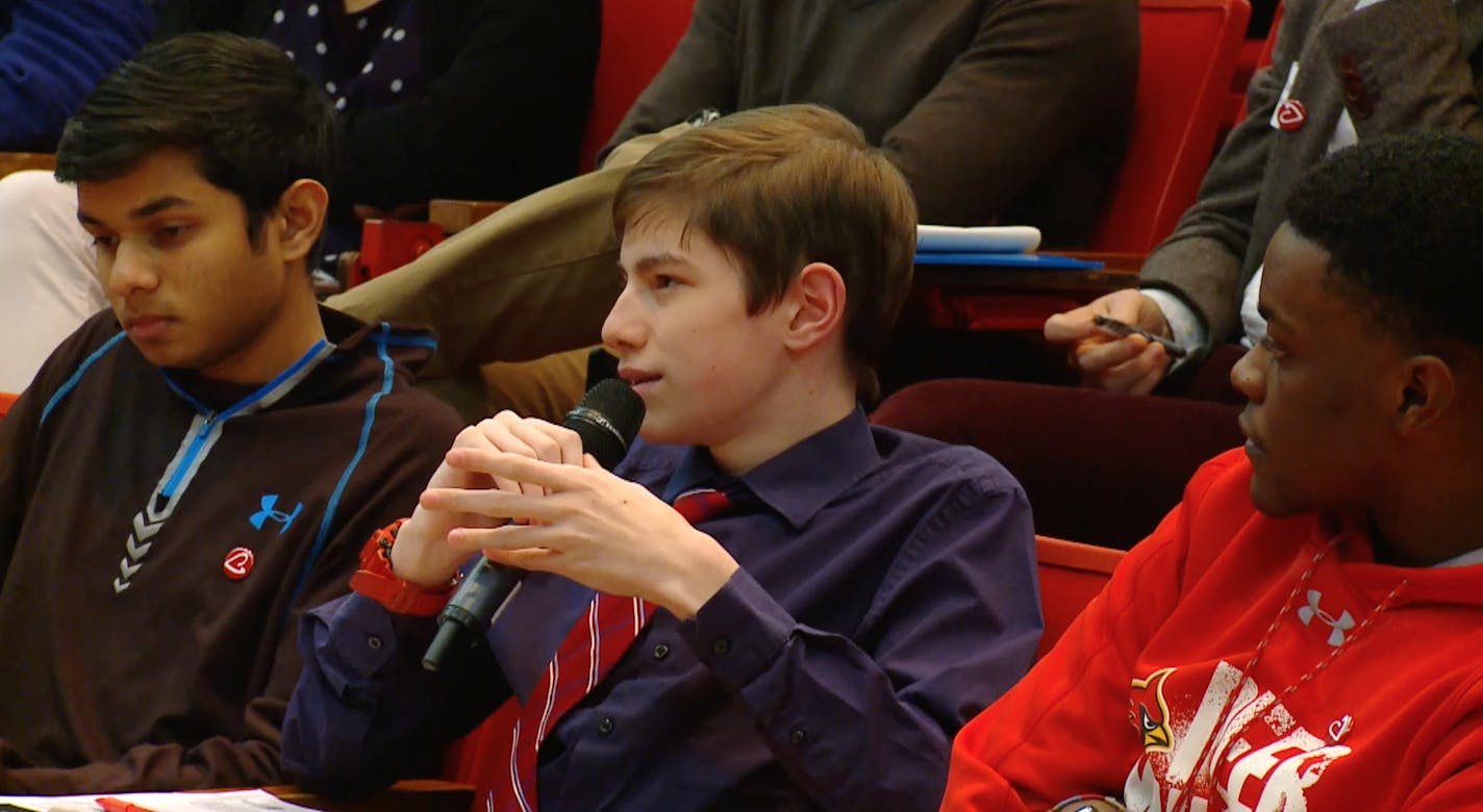 Photo Courtesy of Saint Mary&#x2019;s Press.
Cutline: Andrew Scarborough, center, asks a question at a recent national conference in Baltimore that unveiled the young Catholic findings. The students from left to right are Matt Mathai (Left) Andrew Scarborough (Middle) Ty Brown (Right)
They are students of Calvert Hall High School in Baltimore MD.