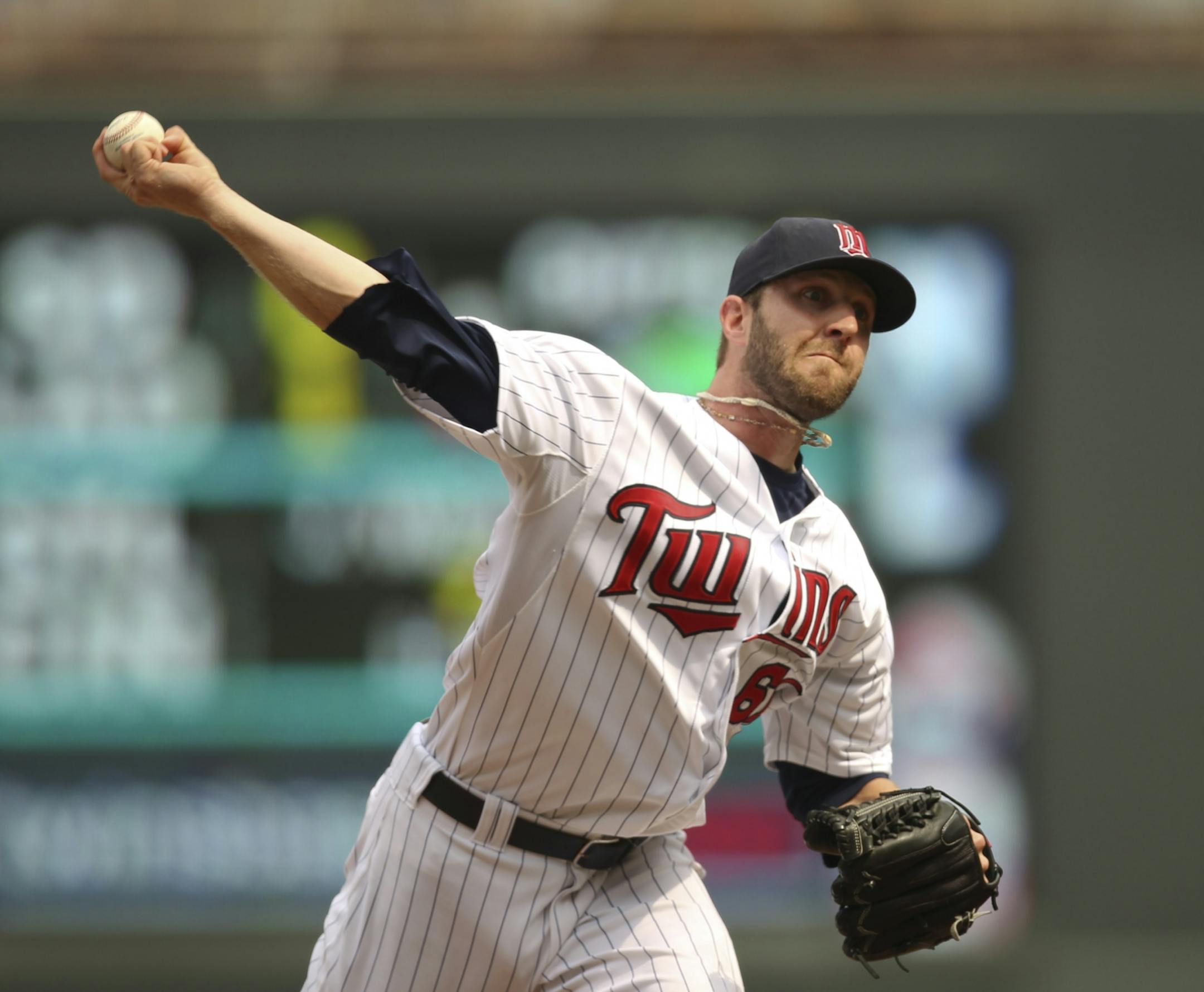 The Twins were swept when they lost to the Oakland A's 9-4 in the third game of their series Sunday afternoon, July 15, 2012 at Target Field in Minneapolis, Minn. Jared Burton pitching for the Twins in the seventh inning.