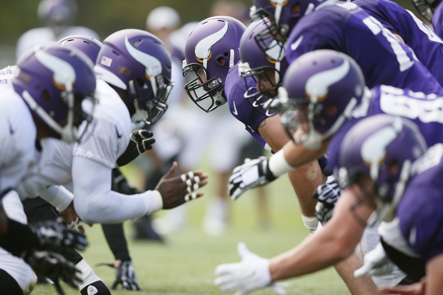 The line of scrimmage is frequently where the action is during training camp.