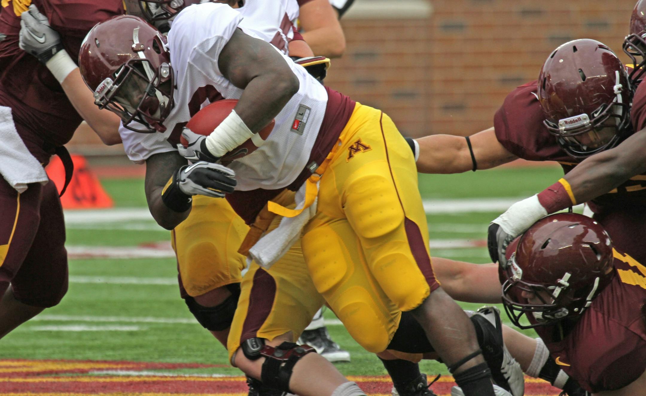 (center) Gold Roster running back Donnell Kirkwood ran for yards, as the Gophers wrapped up spring football practice with the spring game at TCF Bank Stadium on 4/21/12.