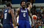 U.S. center DeAndre Jordan yells out after slamming down a rebounded miss shot over Spain's Pau Gasol, right, at a Men's Basketball Semifinal at Cario