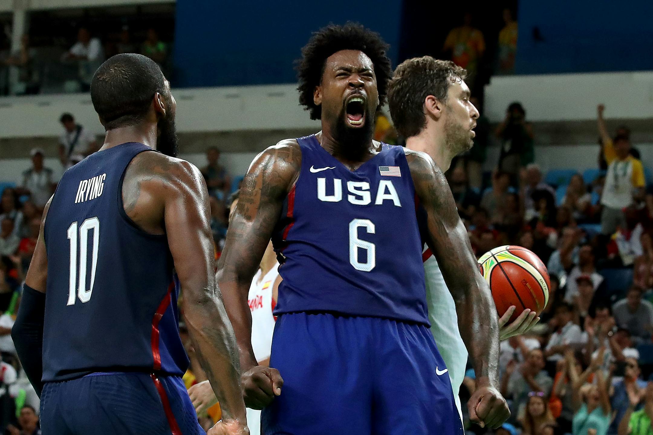U.S. center DeAndre Jordan yells out after slamming down a rebounded miss shot over Spain's Pau Gasol, right, at a Men's Basketball Semifinal at Carioca Arena 1 in Rio De Janeiro, Brazil on Friday, August 19th. (Robert Gauthier/Los Angeles Times/TNS)