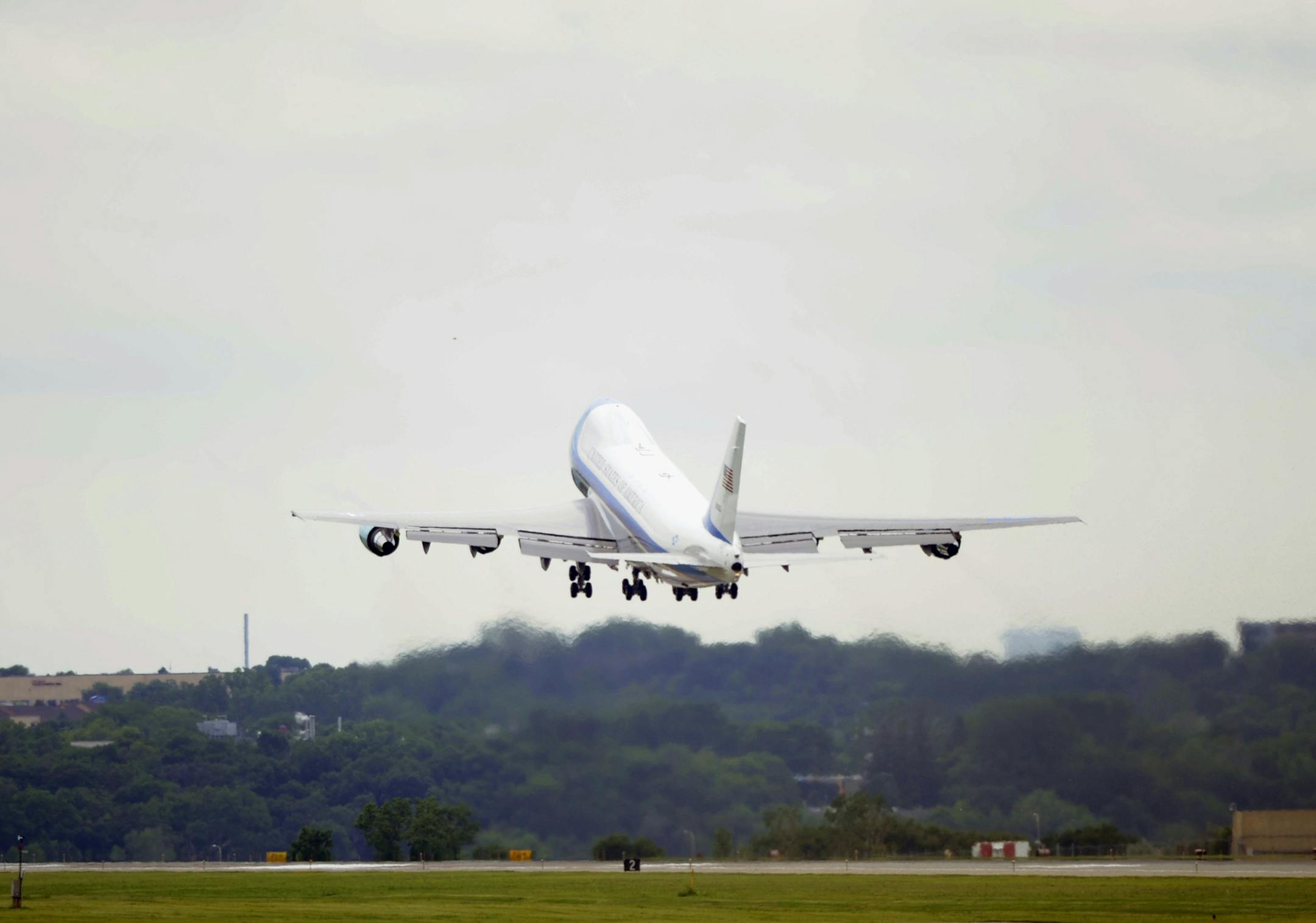 Air Force One, with President Barack Obama aboard, departs from the Minneapolis St. Paul Airport, Air Reserve Station in St. Paul, Minn., Friday, June 27, 2014, for a trip back to Washington. This was the first in a series of Day-in-the-Life visits he plans to make across the country this summer. (AP Photo/Hannah Foslien) ORG XMIT: MNHF103