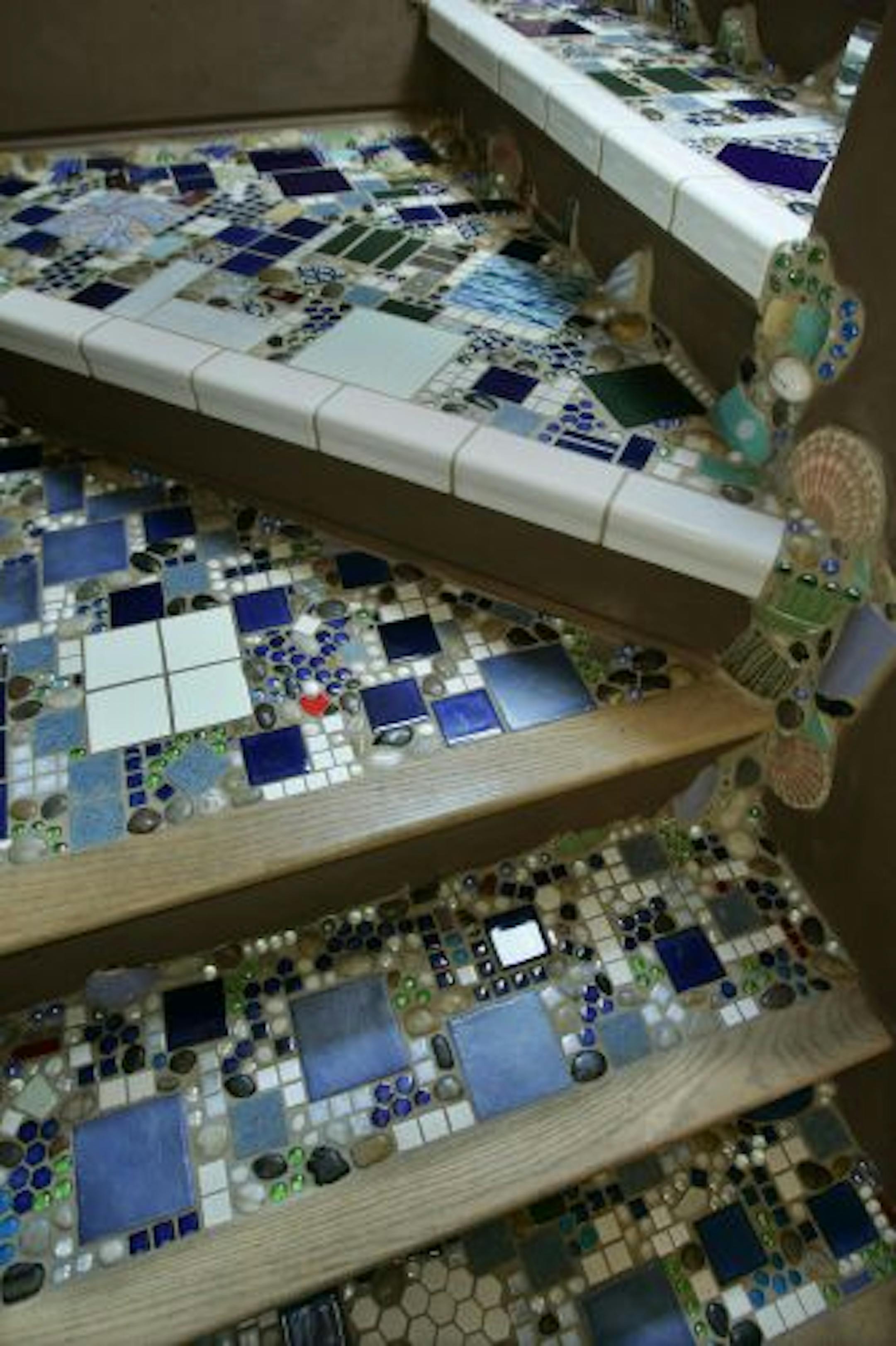 Step up the look of your stairs with mosaic tiled steps like the ones created by Casey Simmons in her Kansas City home.