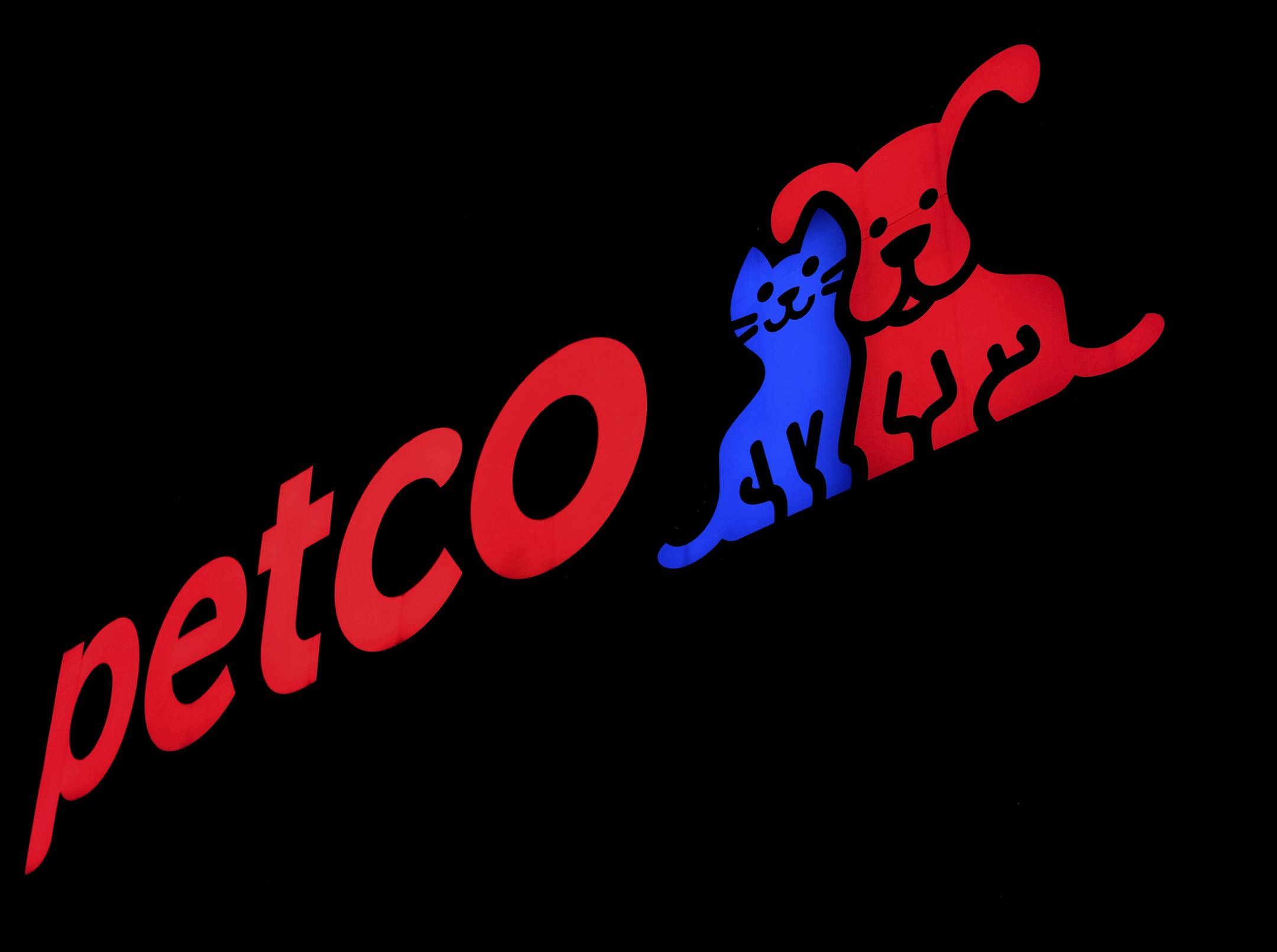 This Nov. 12, 2018, photo, shows a store sign at a Petco store in Chicago. As demand for healthy, natural food is extending from the grocery store to the pet store, Petco announced Tuesday, Nov. 13 that it will stop selling dog and cat food and treats with artificial colors, flavors and preservatives, both online and at its nearly 1,500 stores in the U.S. and Puerto Rico. (AP Photo/Kiichiro Sato)