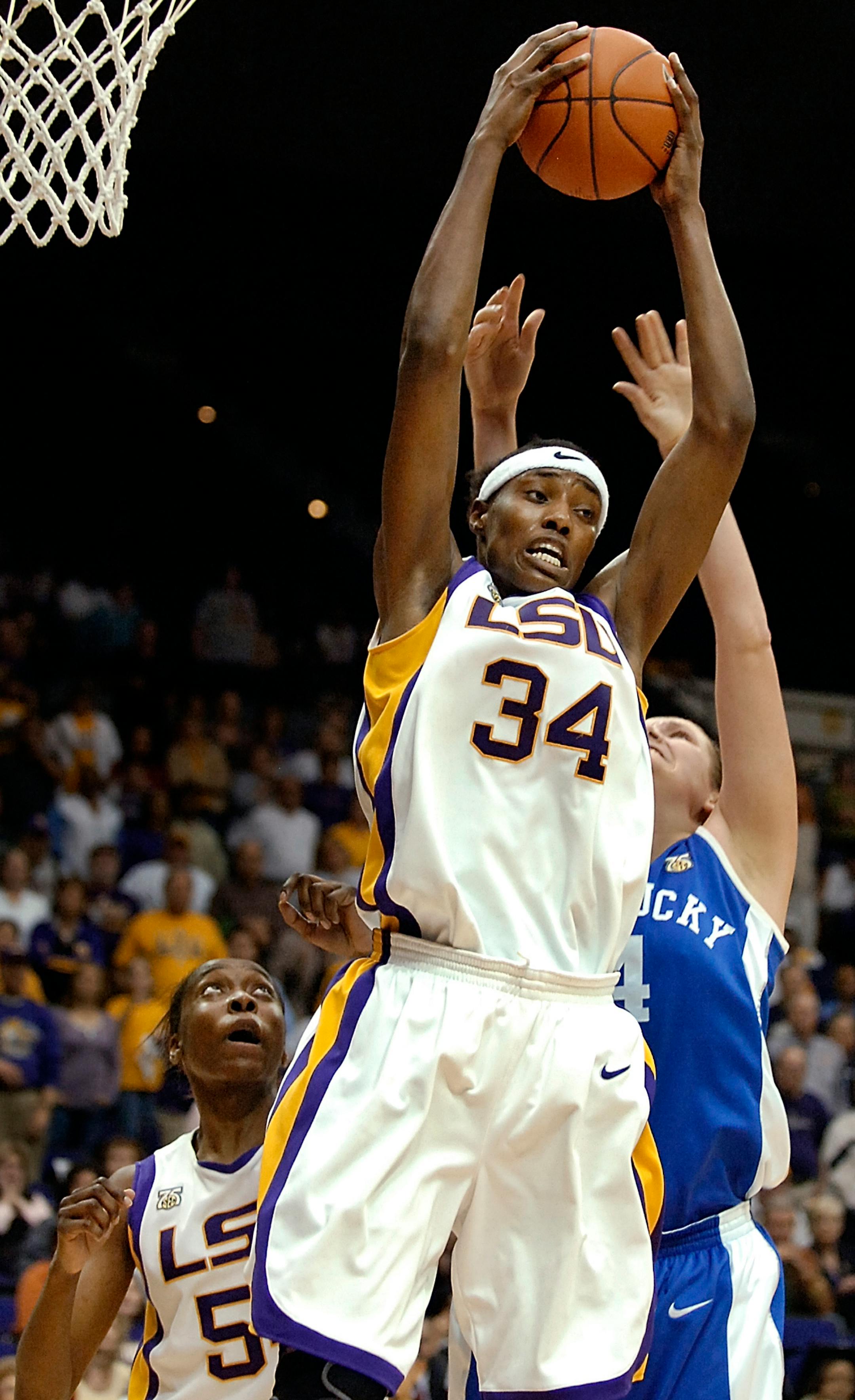 LSU's Sylvia Fowles (34) pulls down the final rebound to preserve the win, in front of Kentucky's Sarah Elliott, right, as LSU's Ashley Thomas, left, watches during the closing seconds of the second half of a basketball game in Baton Rouge, La., in this Feb. 21, 2008 file photo. LSU won 52-48. The Los Angeles Sparks won the lottery for the first pick in the WNBA draft. They are expected to take Tennessee standout Candace Parker, with LSU's Sylvia Fowles going to Chicago at No. 2. After that, the