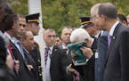 Mahmoud Abbas, president of the Palestinian Authority, kisses the Palestinian flag before it is raised for the first time in the Rose Garden outside t
