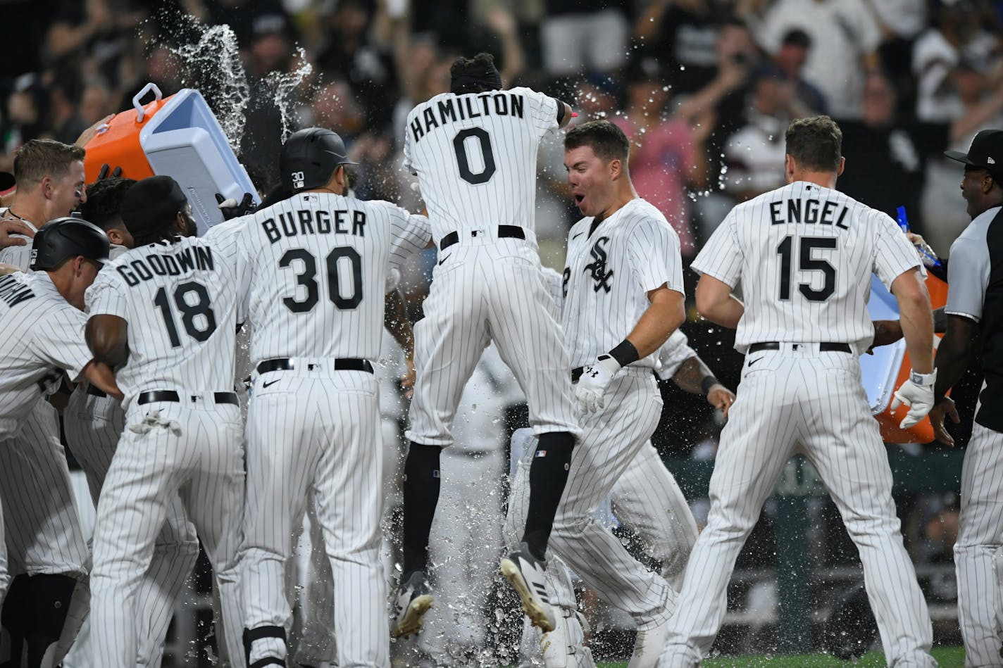 Chicago White Sox's Gavin Sheets center, celebrates with teammates after hitting a walkoff three-run home run to defeat the Minnesota Twins in a baseball game Monday, July 19, 2021, in Chicago. (AP Photo/Paul Beatty)