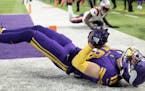 Adam Thielen (19) of the Minnesota Vikings catches a touchdown in the fourth quarter.