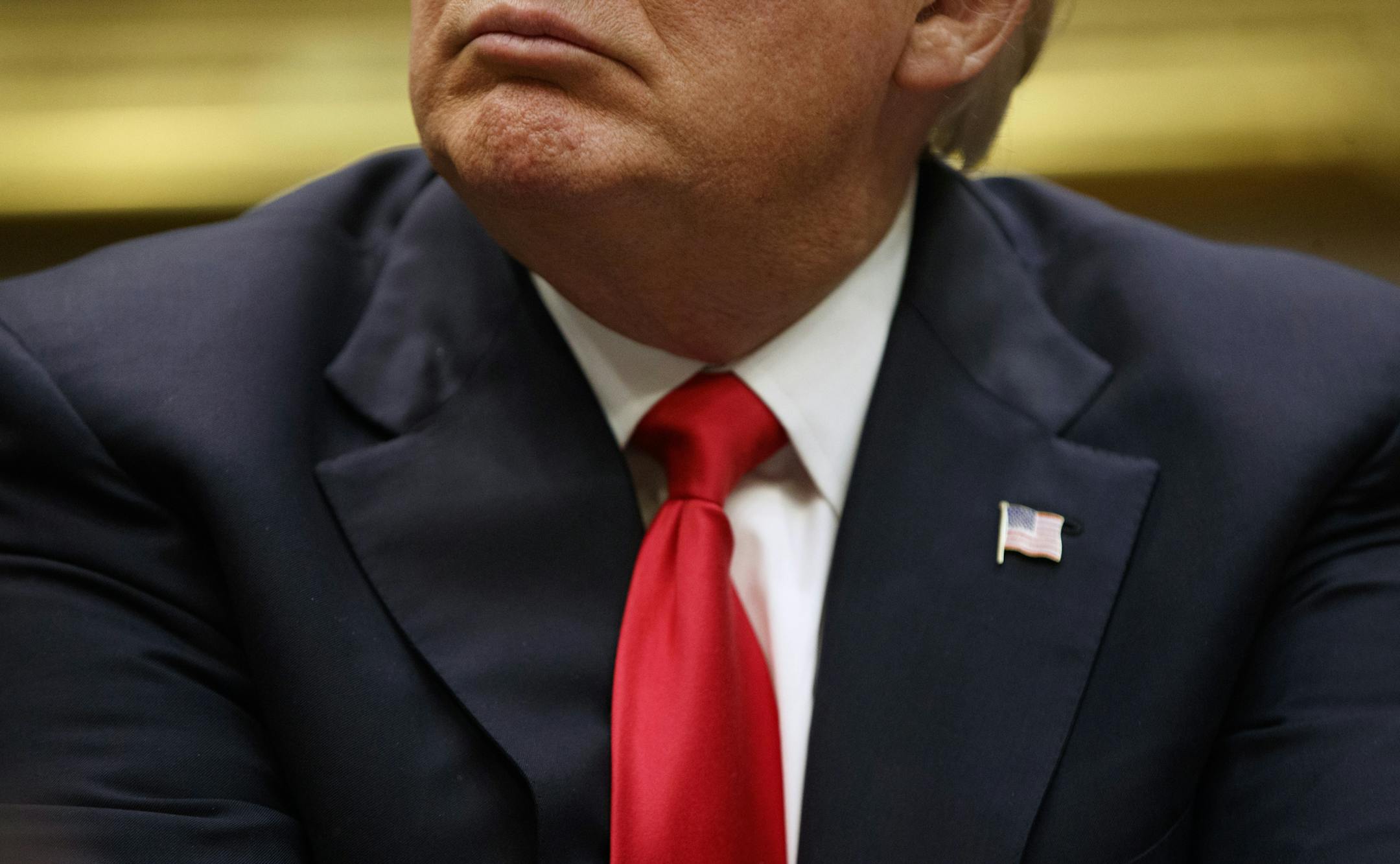 President Donald Trump listens during a meeting with the National Association of Manufacturers, Friday, March 31, 2017, in the Roosevelt Room of the White House in Washington. (AP Photo/Evan Vucci)