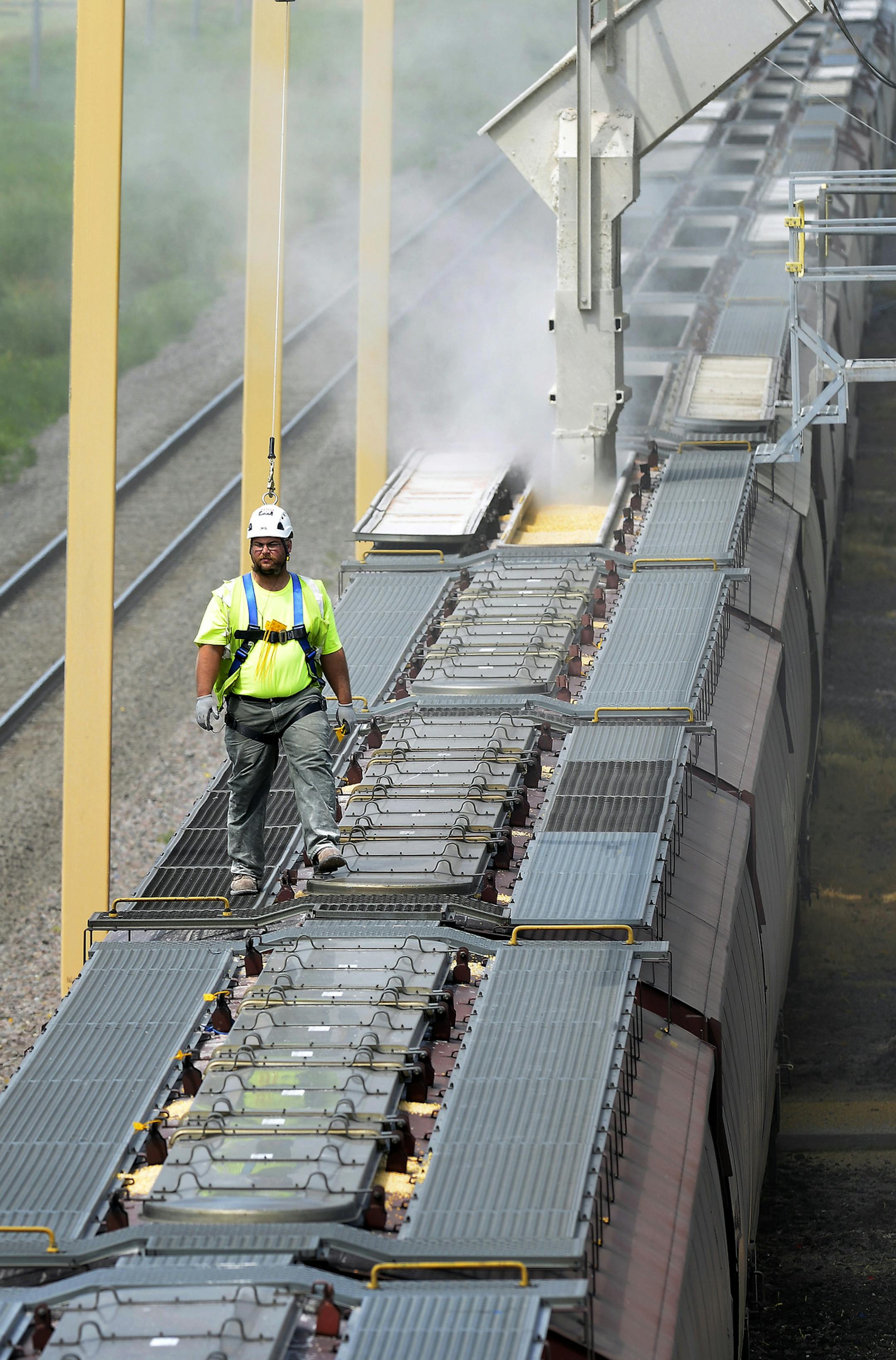 Railcars, which are being loaded with corn at the Alton Grain Elevator, just outside of Hillsboro, N.D., Aug. 6, 2014. Energy exploration in North Dakota is creating a crisis for farmers whose grain shipments have been held up by a vast new movement of oil by rail, leading to millions of dollars in agricultural losses. (Dan Koeck/The New York Times) ORG XMIT: MIN2014082716004833