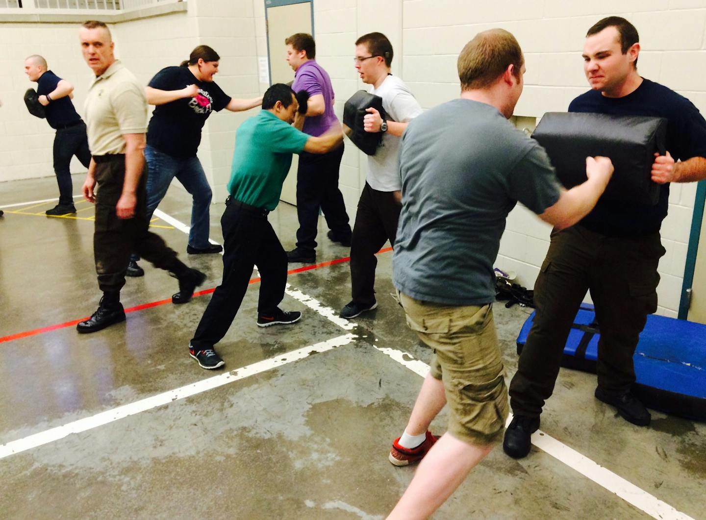 Sheriff's reserve recruits practice defensive tactics under the supervision of Deputy Pete Godfrey, a Krav Maga trainer.