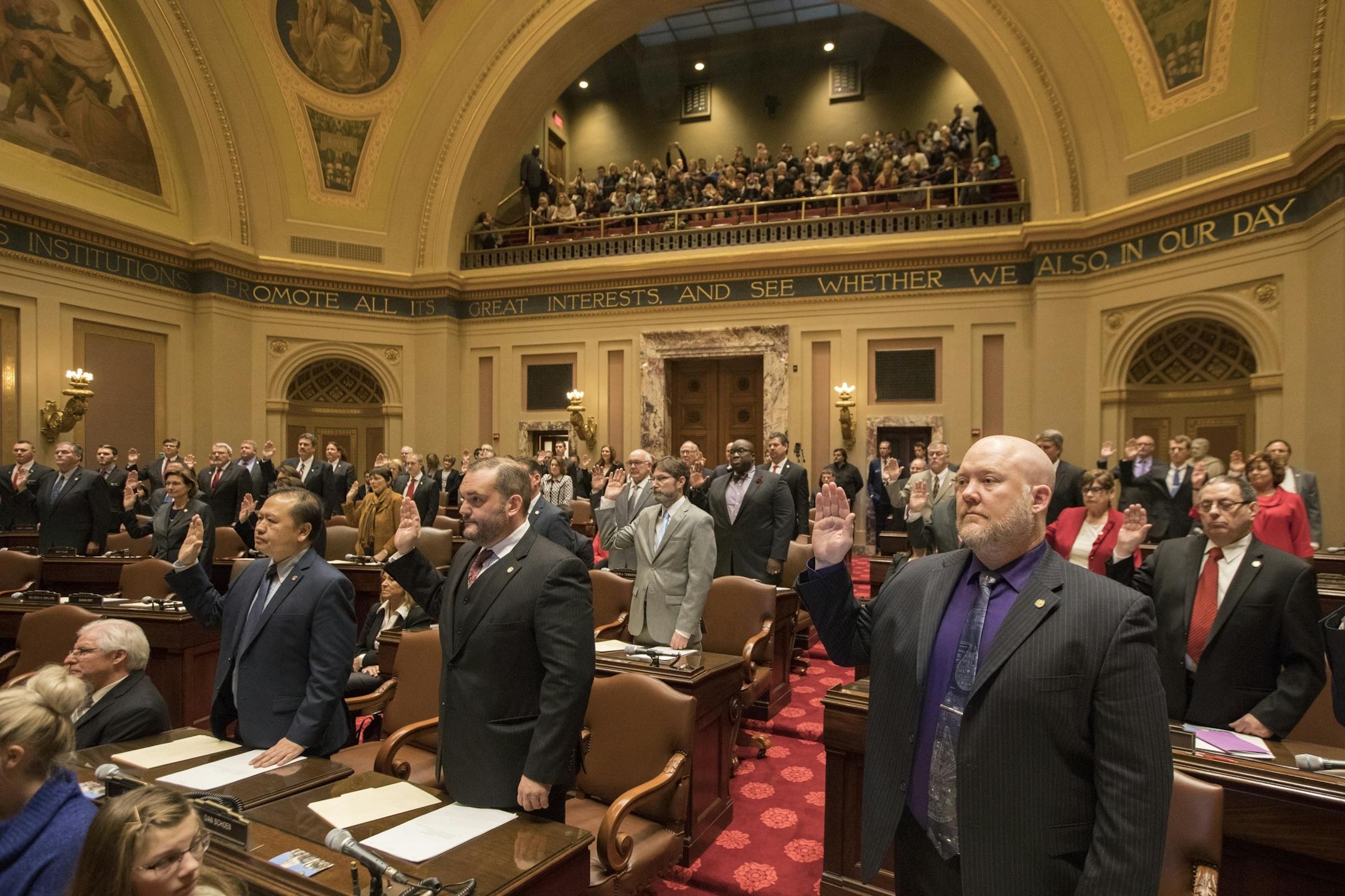 Senators are sworn in during the session in the Minnesota Senate chambers.