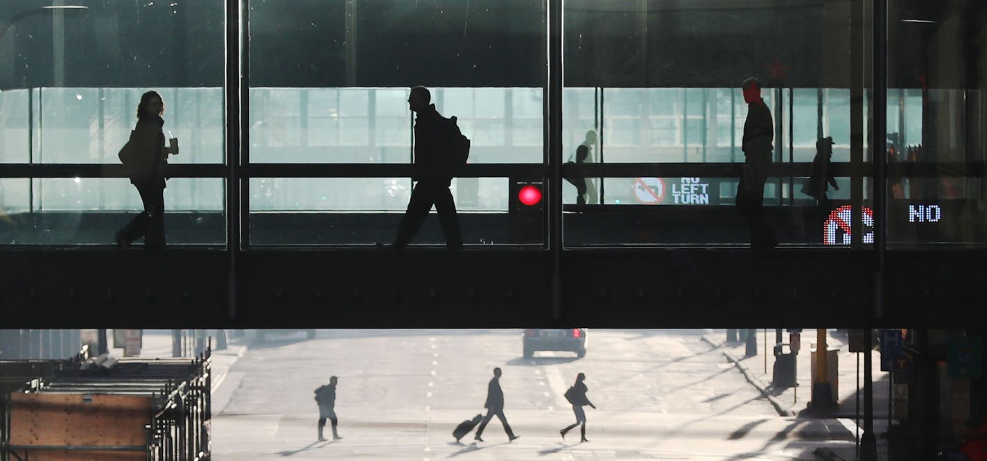 Entrepreneur Eric Dayton and skyway critic, along with three fellow skyway critics, launched their "Skyway Avoidance Society" to encourage people to walk on the sidewalk Wednesday, Nov. 16, 2016, along Nicollet Avenue near 8th St. S. in Minneapolis, MN. Here, as Dayton, not pictured, worked a nearby street corner, pedestrians come and go along the street and skyway.](DAVID JOLES/STARTRIBUNE)djoles@startribune.com One of the most vocal critics of Minneapolis skyways, entrepreneur Eric Dayton, is