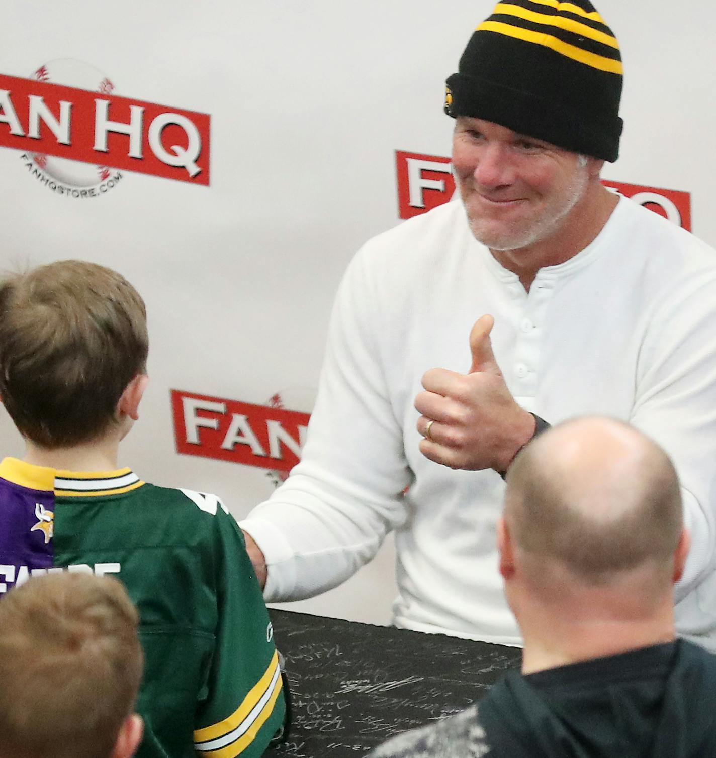 Former Green Bay Packers and Minnesota Vikings quarterback Brett Favre gave a thumbs up to young fan Calvin Lindquist, 9, of Maple Grove, who wore a jersey stitched with a Favre Vikings and Packers jersey. Favre posed for photos with fans and signed autographs at Ridgedale Mall Saturday, Feb. 3, 2018, in Minnetonka, MN.] DAVID JOLES &#xef; david.joles@startribune.com Former Green Bay Packers Quarterback Brett Favre will sign autographs for fans at the Ridgedale Mall Saturday.**Calvin Lindquist,c