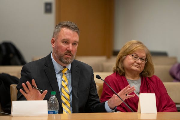 Daron Korte, assistant commissioner of the Minnesota Department of Education, left, responded to questioning by Sen. Roger Chamberlain on Wednesday. S