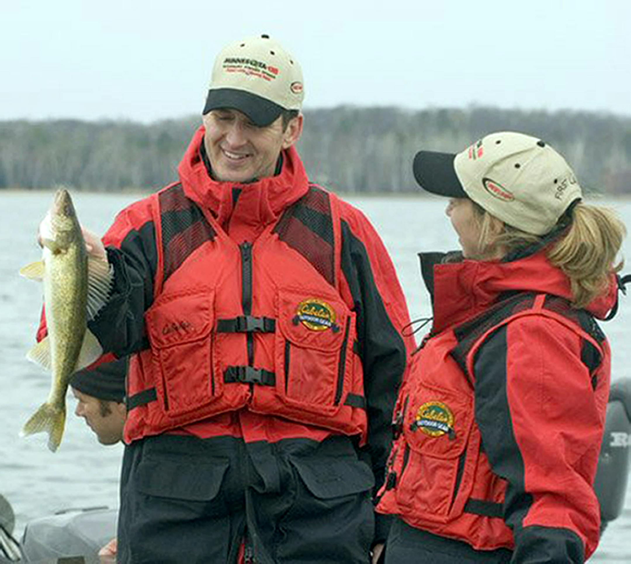 Pawlenty, with First Lady Mary Pawlenty, holds a 17-inch walleye he caught during the Governor's 60th Annual Fishing Opener on the north end of Pelican Lake in Breezy Point, Minn.