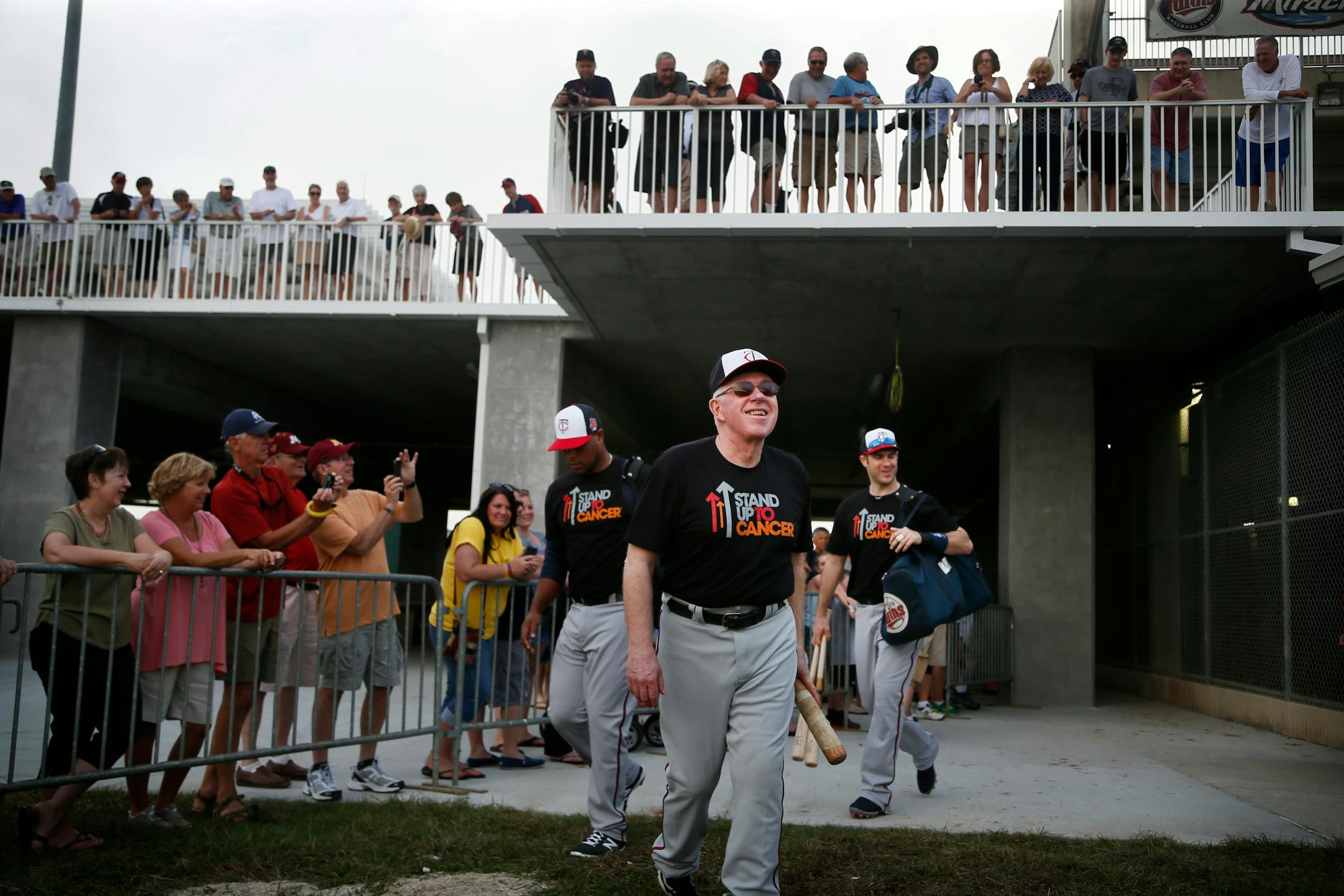 Former Twins manger Tom Kelly chatted with fans as the team walked to the practice fields during spring training in 2014.