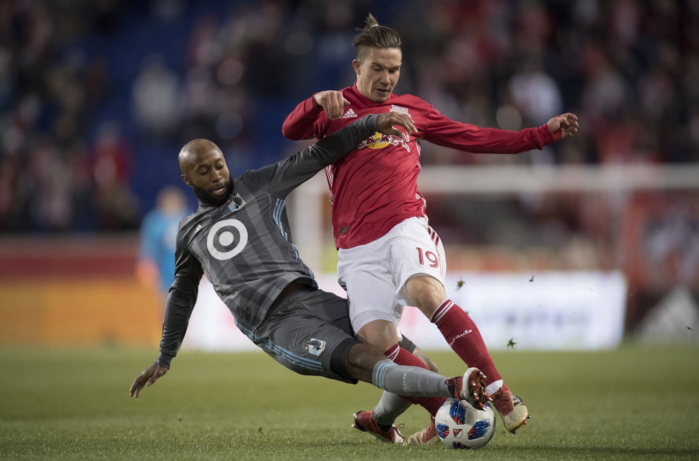 Collen Warner #26 of Minnesota United FC battles for the ball against Alex Muyl #19 of New York Red Bulls at Red Bull Arena on Saturday night, March 24, 2018.
(Ben Solomon for the Minneapolis Star Tribune)