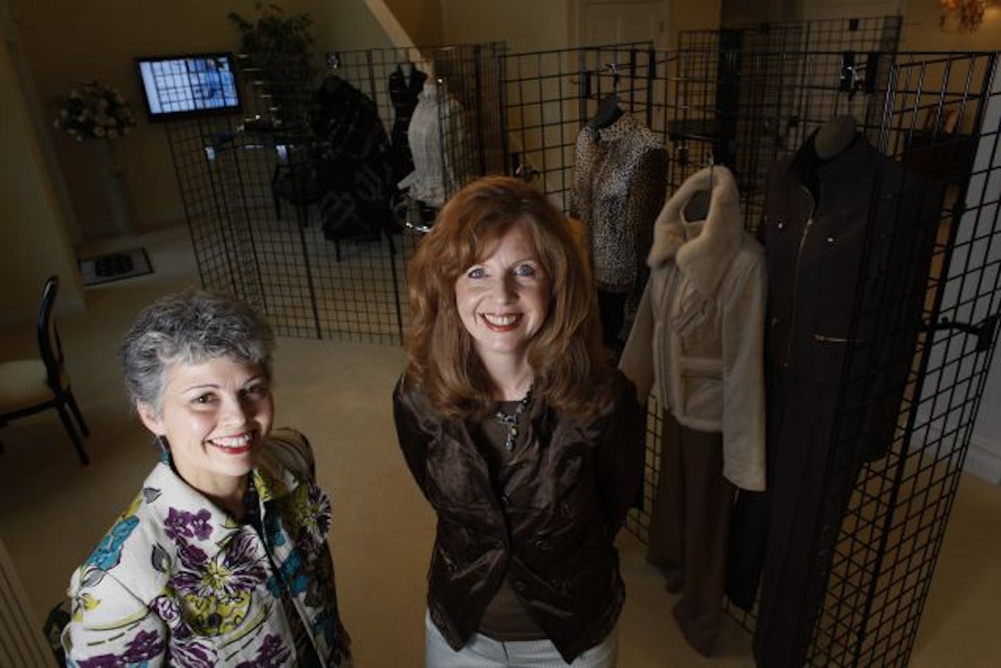 Lisa Swan, left, and Sherry Walker of the Sherralise Group posed at their White Bear Lake office. The two were wardrobe consultants for Dayton's Oval Room clients before starting their own personal shopping business.