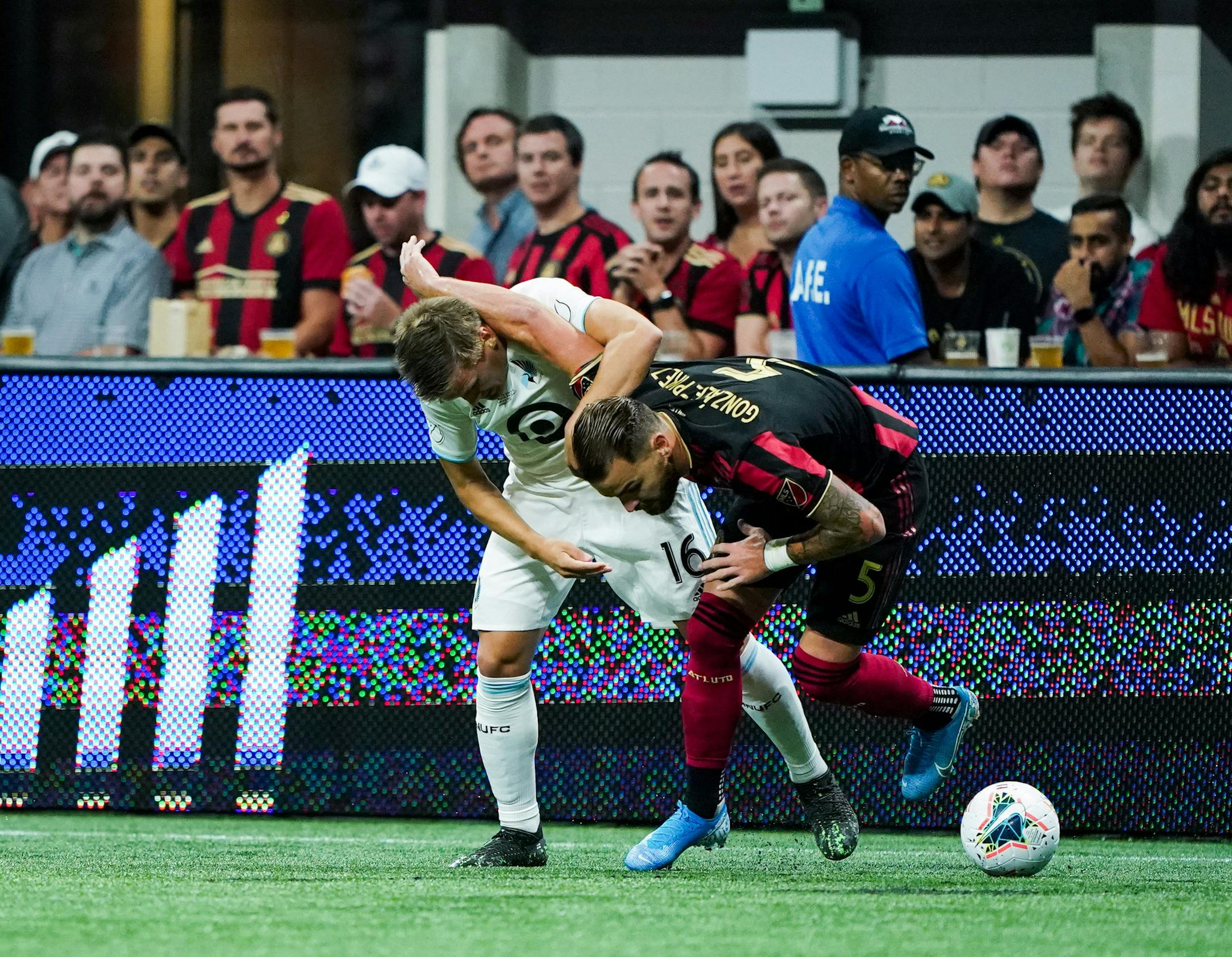 Minnesota United midfielder Robin Lod (16) and Atlanta United defender Leandro Gonzalez (5) battle for the ball during the U.S. Open Cup at Mercedes-Benz Stadium in Atlanta on Tuesday, Aug. 27, 2019. Photo by Kevin D. Liles for the Star Tribune