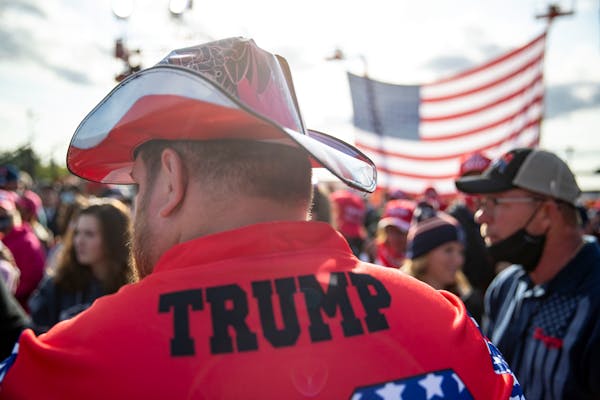 A Trump campaign volunteer looked over the crowd at Bemidji Aviation Services in September 2020 as attendees awaited the president’s arrival.