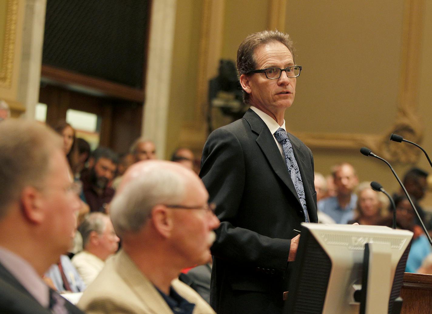 Deputy City Attorney Peter Ginder addressed crowded controversial hearings in Minneapolis City Council chambers on whether the city should take form its own utility, Thursday, August 1, 2013 in Minneapolis, MN. (ELIZABETH FLORES/STAR TRIBUNE) ELIZABETH FLORES &#x2022; eflores@startribune.com