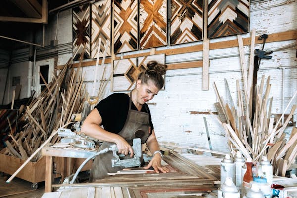 Anna Bailey at work in her wood shop.
