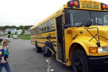 Students board the bus on their way to school. Lakeville Area Public Schools will introduce a fully electric bus for students to ride to and from scho