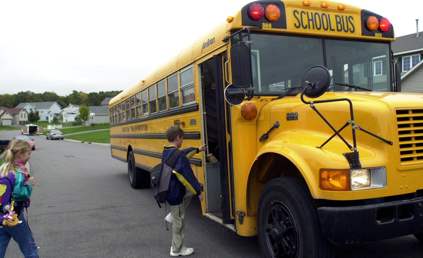 Students board the bus on their way to school. Lakeville Area Public Schools will introduce a fully electric bus for students to ride to and from school this year. ORG XMIT: MIN2017072514055639