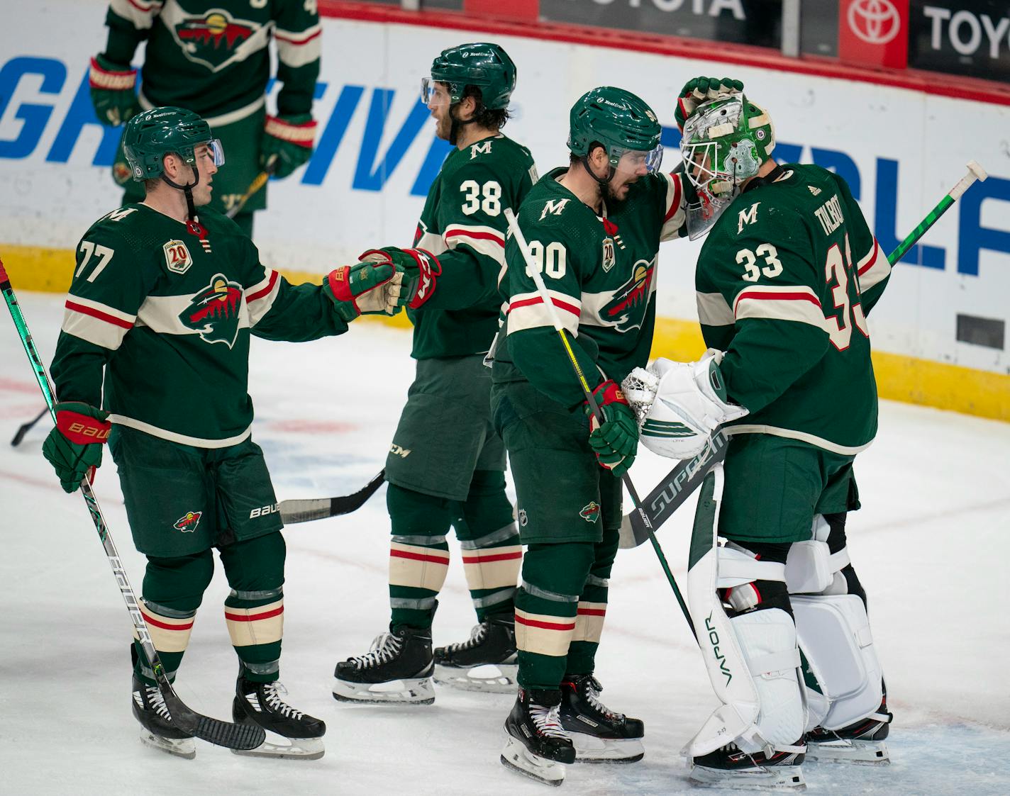 Minnesota Wild center Marcus Johansson (90) celebrated the 2-1 win with Wild goaltender Cam Talbot (33). At left were Wild defenseman Brad Hunt (77) and right wing Ryan Hartman (38). ] JEFF WHEELER • jeff.wheeler@startribune.com