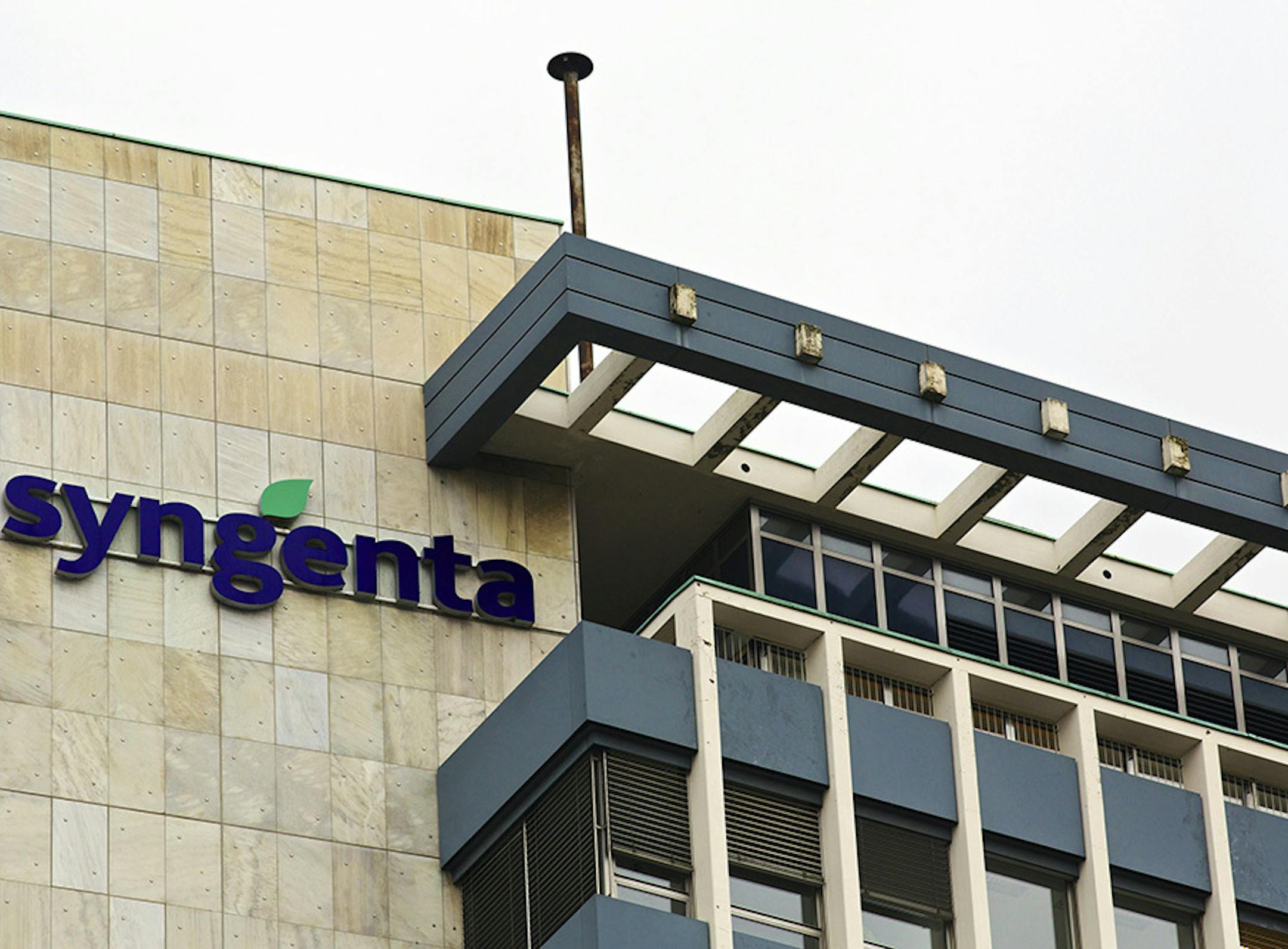 A logo sits on a wall outside Syngenta AG's headquarters in Basel, Switzerland, on Wednesday, Feb. 5, 2014. Syngenta, the world's largest maker of crop chemicals, reported profit that missed analysts' estimates and Chief Executive Officer Mike Mack pledged to cut $1 billion in costs by 2018 to boost efficiency. Photographer: Gianluca Colla/Bloomberg ORG XMIT: 467508971