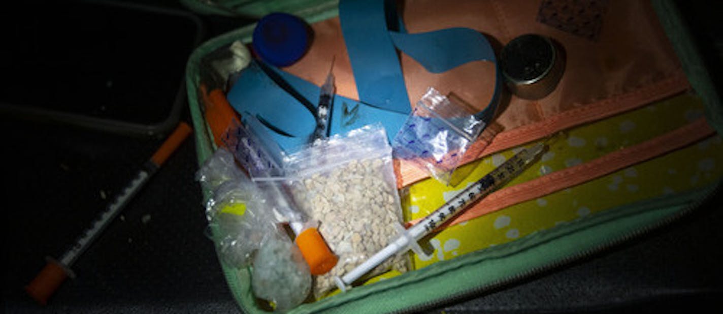 A few grams of heroine and collection of needles, some uncapped, were found by Deputy Ben Fye from the St. Louis County Sheriff's Office in a small bag in a car pulled over in a Walgreens parking lot in Duluth around 2am Thursday morning.] ALEX KORMANN • alex.kormann@startribune.com In recent years there has been a large increase in meth, heroine and opioids flowing into Duluth, MN in recent years. The Duluth Police Department and St. Louis Sheriff's Department has worked in tandem with the DEA