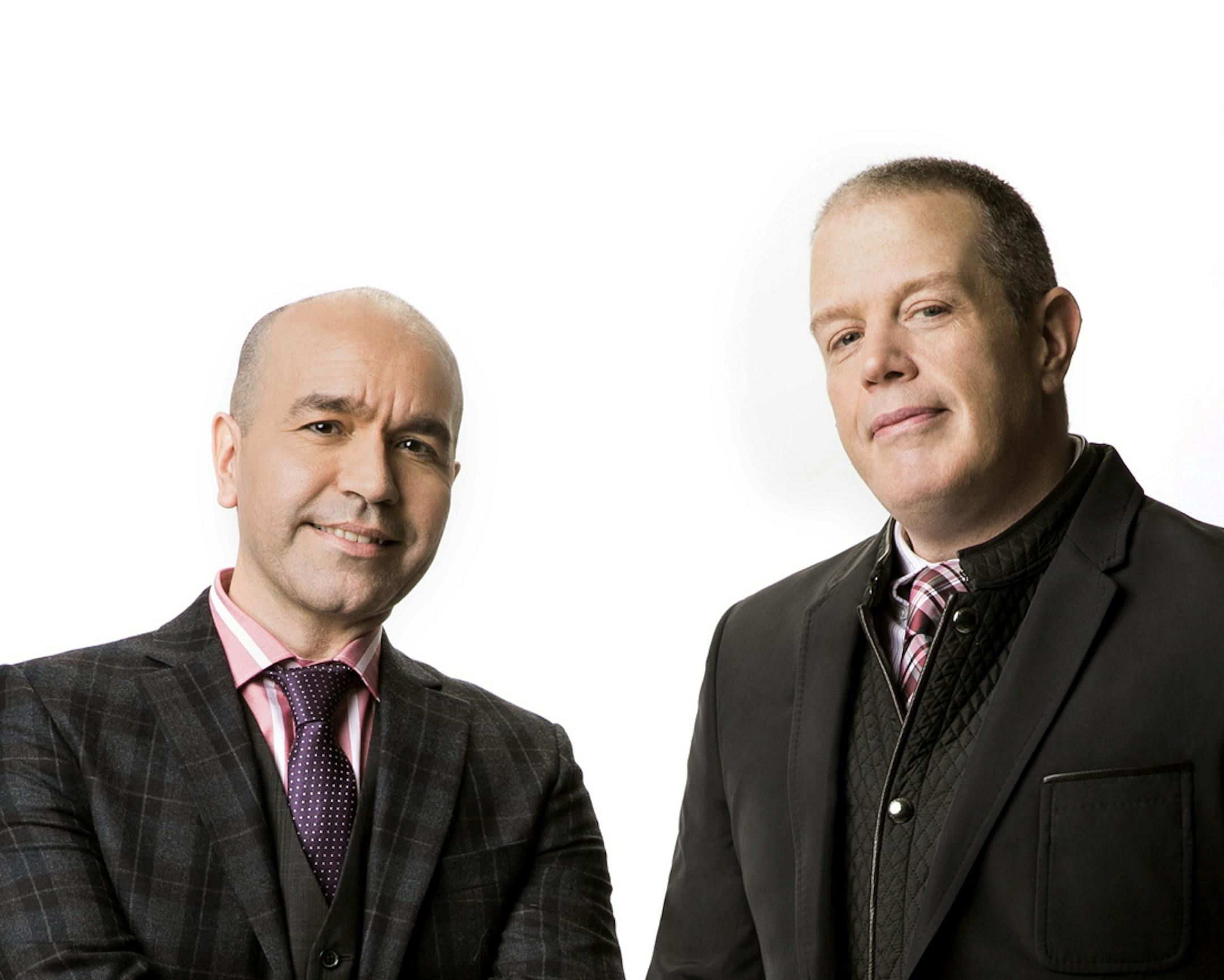 This undated image released by Perigee Trade shows Lorenzo Marquez, left, and Tom Fitzgerald, authors of the book, "Everyone Wants to Be Me or Do Me." The fabulously funny but sometimes snarky blogging team known as TLo is also a real-life couple of 17 years. They've been blogging celebrity style and fashion for over a decade and have more than 237,000 followers on Twitter. Now, the guys at TomandLorenzo.com have their first book, "Everyone Wants to Be Me or Do Me," out Feb. 4 from Perigee Trade