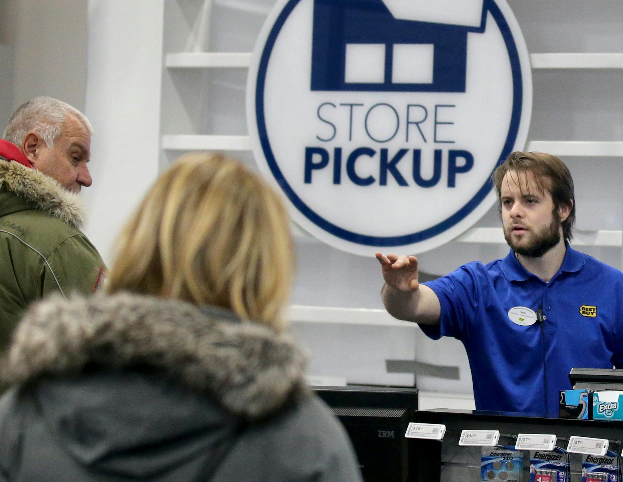 Best Buy customer service specialist Seth Hotchkiss waited on customers at the store in Roseville. Going for pickup rather than delivery might be worth the trouble this time of year, police say.