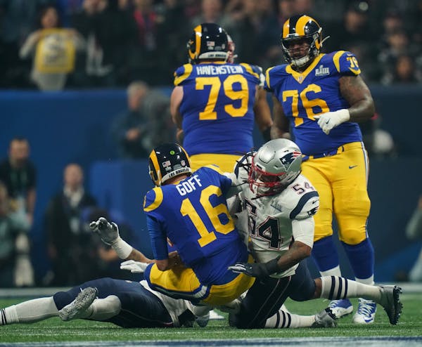 New England Patriots linebacker Dont'a Hightower (54) sacks Los Angeles Rams quarterback Jared Goff (16) during the third quarter of Super Bowl LIII b