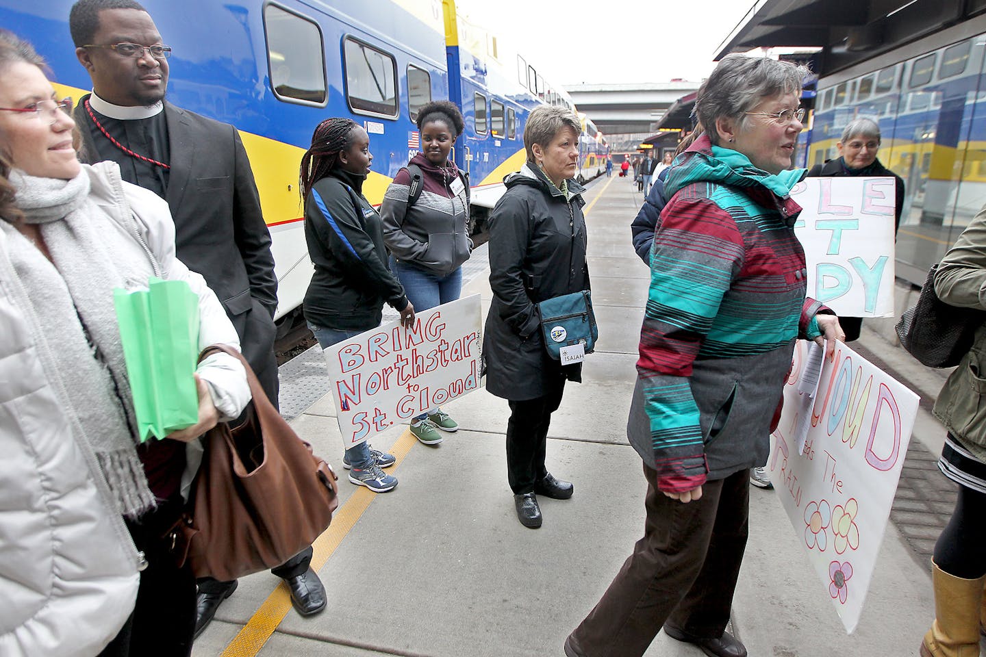 A contingent from the group Isaiah made their way off the the Northstar Commuter Line at the Target Field Station on Thursday.