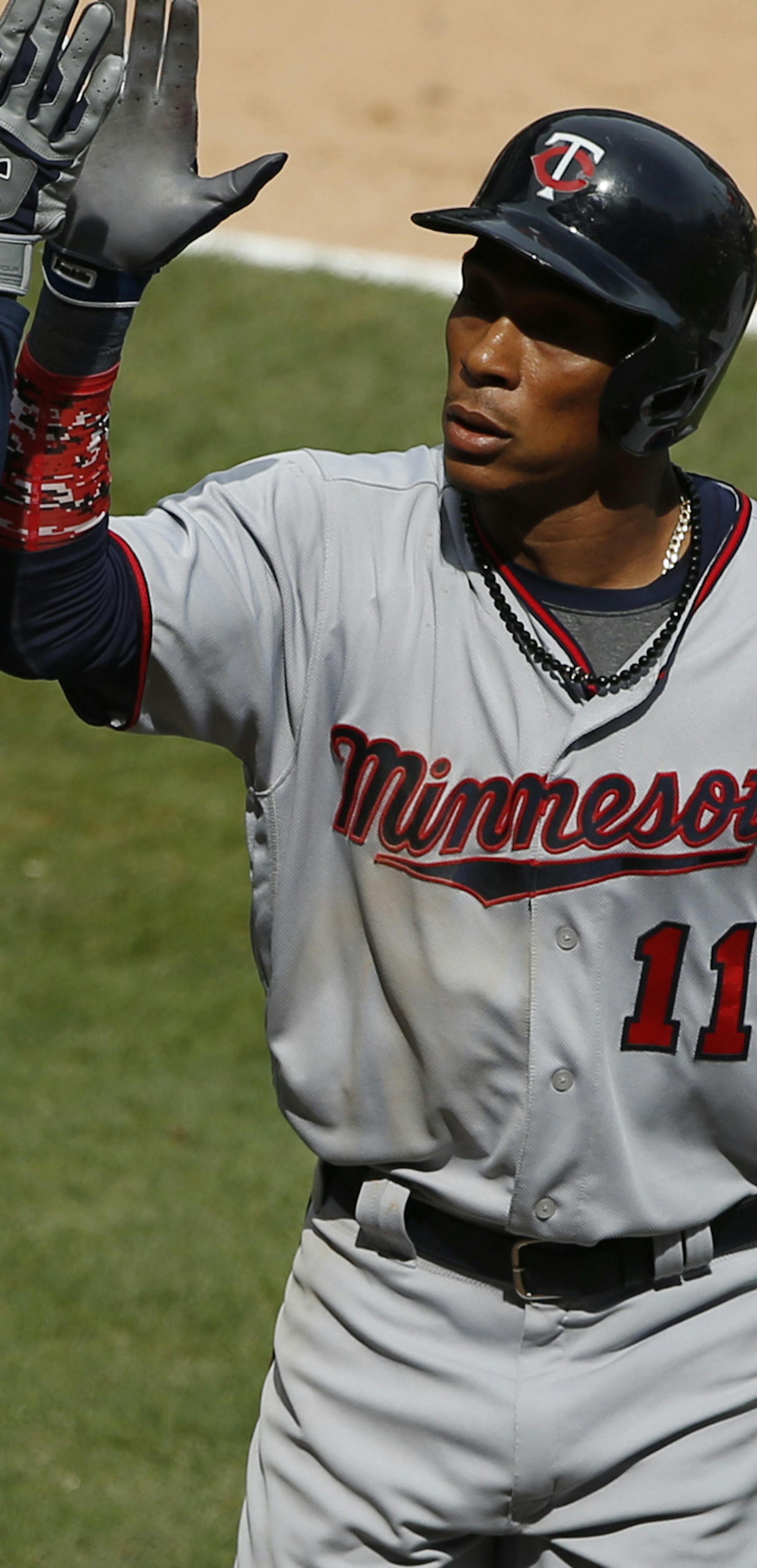 Minnesota Twins' Jorge Polanco, right, celebrates with Byron Buxton after hitting a solo home run against the Chicago White Sox during the seventh inning of a baseball game Sunday, April 9, 2017, in Chicago. The Twins won 4-1. (AP Photo/Nam Y. Huh)