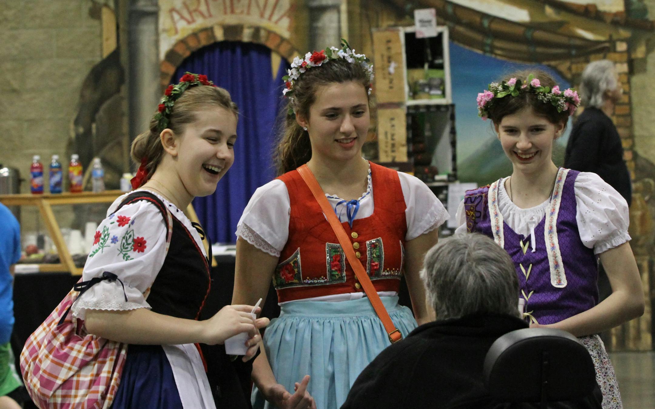 (left to right-top row) Mary Yanta, Michelle Stepan and Elizabeth Mansfield, of the Czech Slovak Dance Group talked with Carol Ruivivar of St. Paul during the Festival of Nations at the St. Paul RiverCentre on 5/3/13.] The Festival of Nations event has been going since 1932 and will run this year through May 5th. The event that attracts over 58,000 people, features cultural exhibits, folk art demonstrations, food, music and an international bazaar.] Bruce Bisping/Star Tribune bbisping@startribun