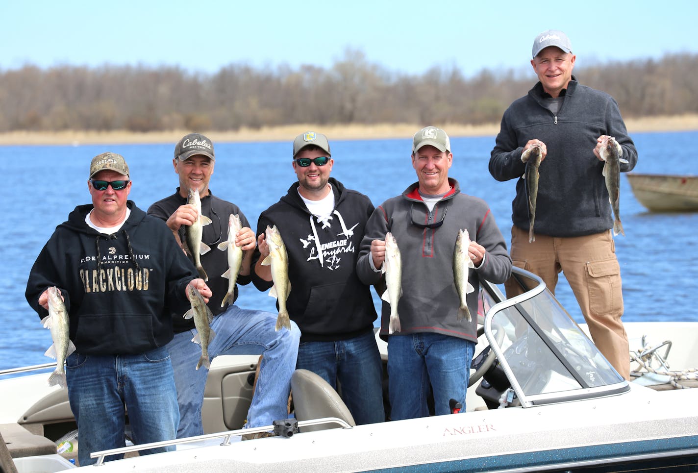 Great weather, great fishing: Twin Cities anglers on Upper Red Lake on Saturday's opener took their limits. From left, Pete Mogren, John Heroff, Corey Mogren, Paul Kreutzfeldt and Larry Berndt took their four-walleye limits using slip bobbers and minnows.