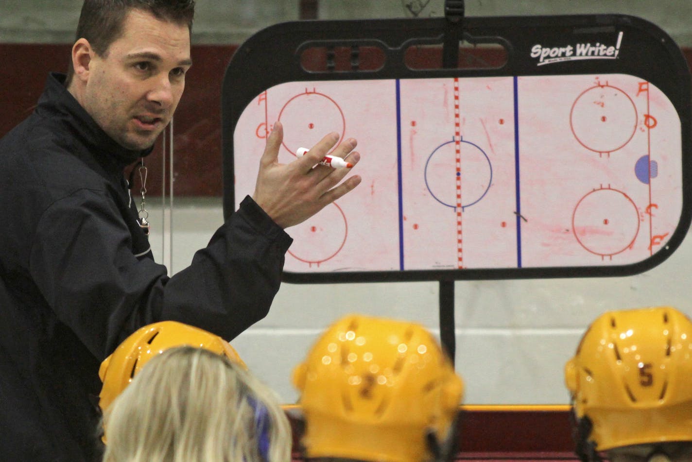 Gophers Women's Hockey Head Coach Brad Frost ran practice at Ridder Arena on 1/30/13.] Bruce Bisping/Star Tribune bbisping@startribune.com Brad Frost/roster. ORG XMIT: MIN1301301654002730