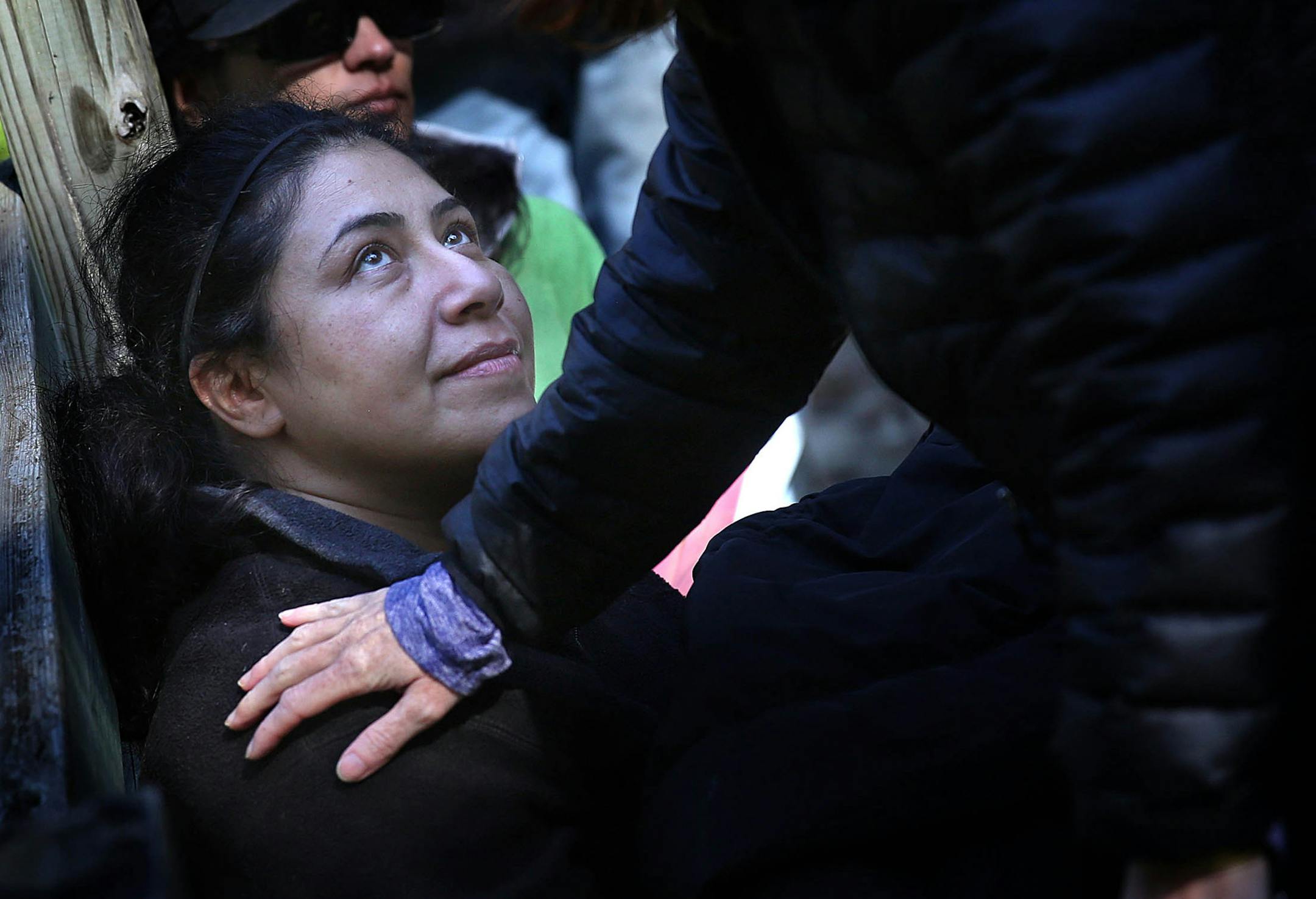 Refugee Mina Ghorashi was comforted by Dr. Cecily Wait at one of the refugee camps in the humanitarian crisis simulation in Cannon Falls, Minn.