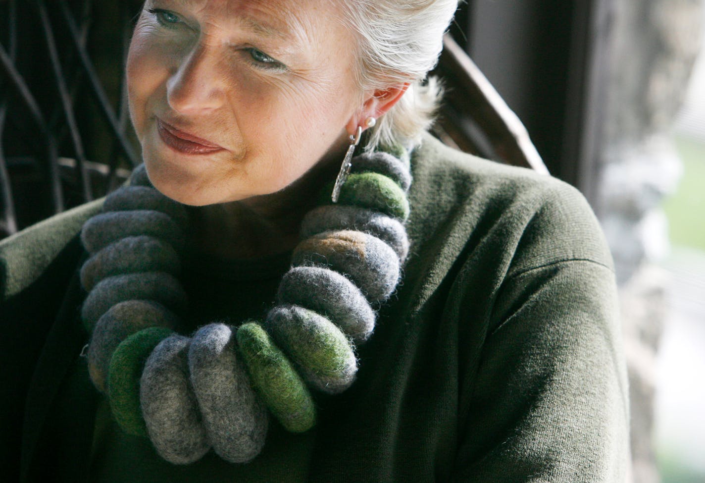 Artist Laurie Jacobi with a wool necklace she designed.