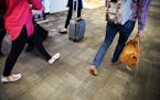 Worn areas of the gray carpet in both terminals at Minneapolis-St. Paul International Airport will be replaced in time for the Super Bowl. Richard Tso
