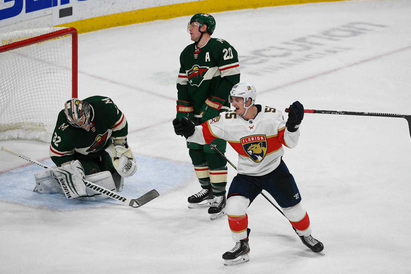 Panthers right winger Noel Acciari, right, celebrated in front of disappointed Wild defenseman Ryan Suter (20) and goalie Alex Stalock after Acciari tipped in the game-winning goal with 5.6 seconds left in the Panthers' 5-4 victory Monday night.