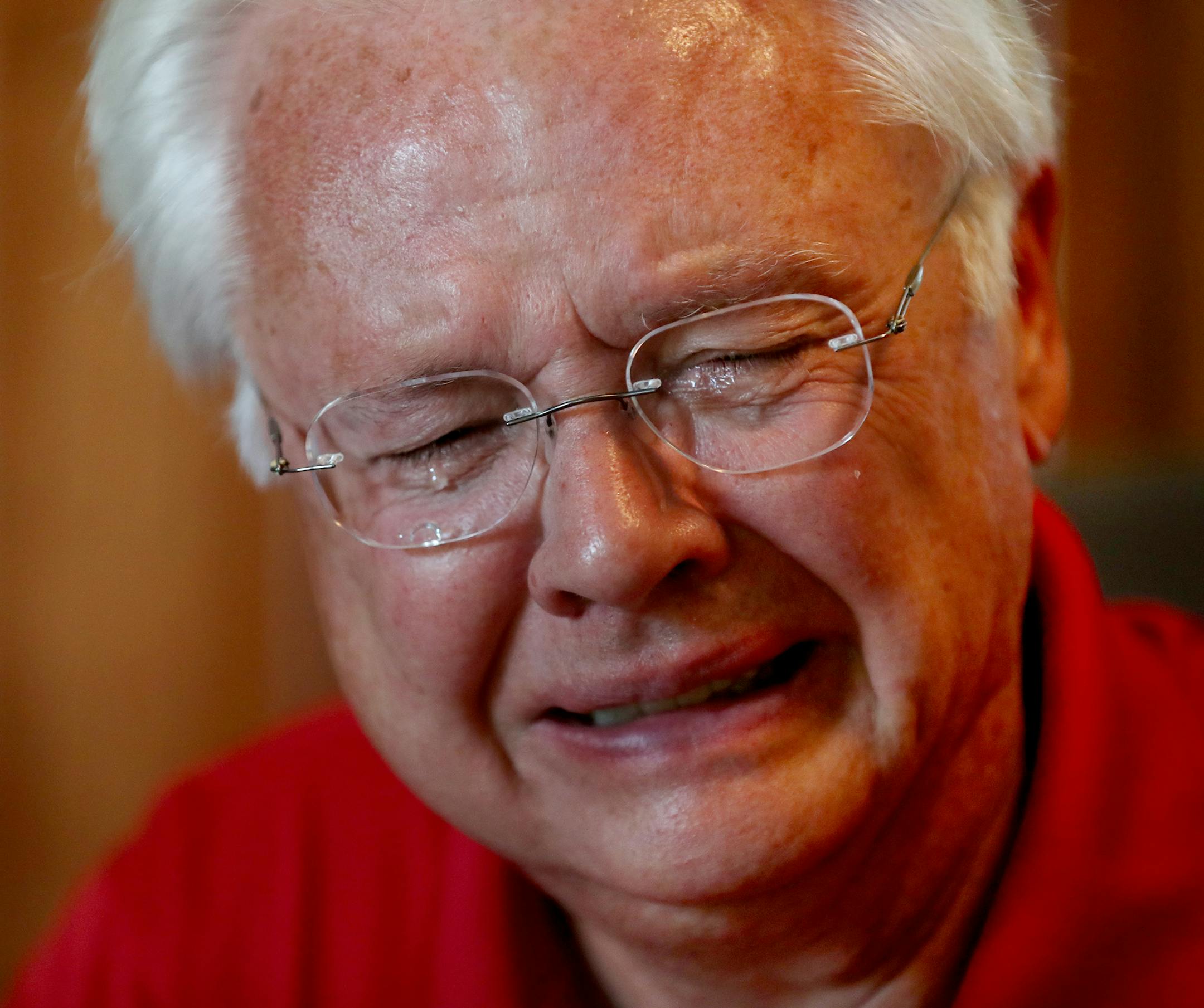 Doug Arneson became emotional while talking about his uncle, Navy Cmdr. John Micheel, who was shot down during the Korean War. At left is a painting of Micheel that Arneson keeps in his home.